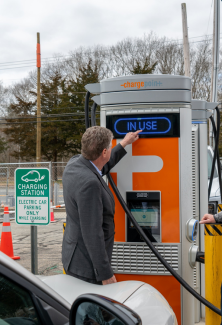 Gov McKee checking out an electric car charger