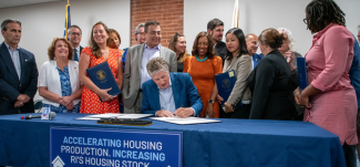 Governor McKee signing a document