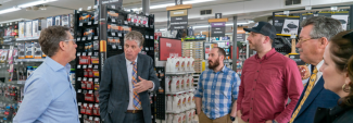 Governor McKee talking to people at a supermarket