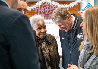 Gov McKee interacting with elderly person at event