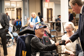 McKee Shaking Hands with disabled Veteran